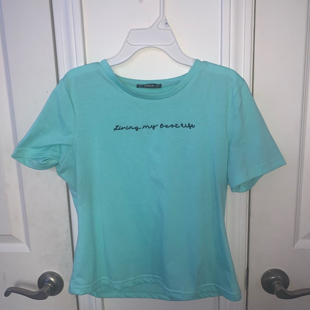 a electric teal cropped shirt